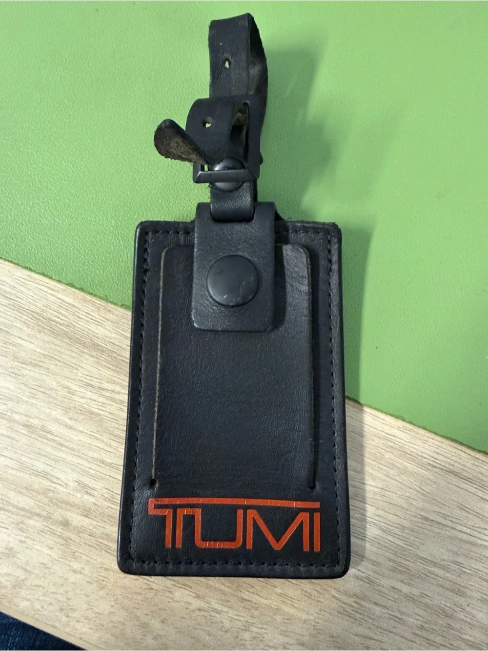 Tumi Black Leather Luggage Tag with Orange Logo